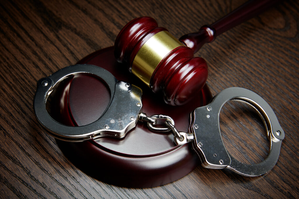 Denver domestic violence attorney defense concept with gavel and handcuffs