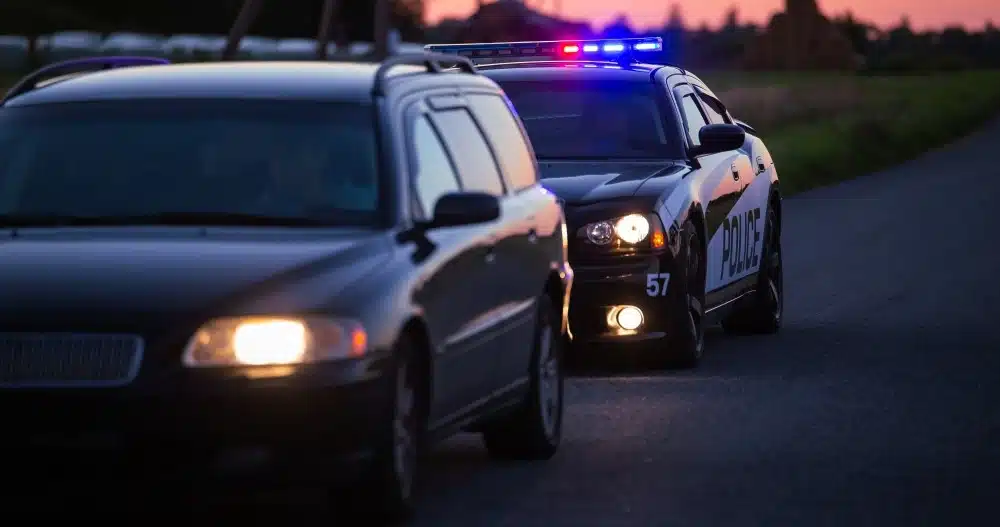 Police conducting a roadside traffic stop at night related to Colorado implied consent laws